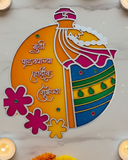 Decorative cutout with text and flowers on a marble surface with candles